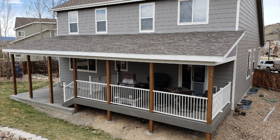 covered colorado porch with white railing