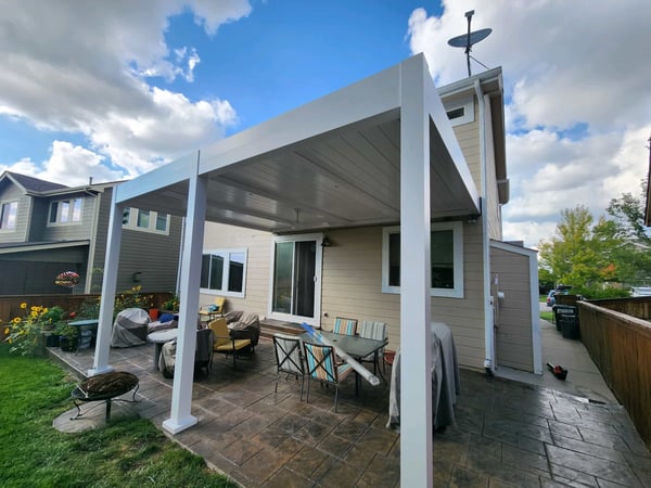  A patio covered with a white canopy.