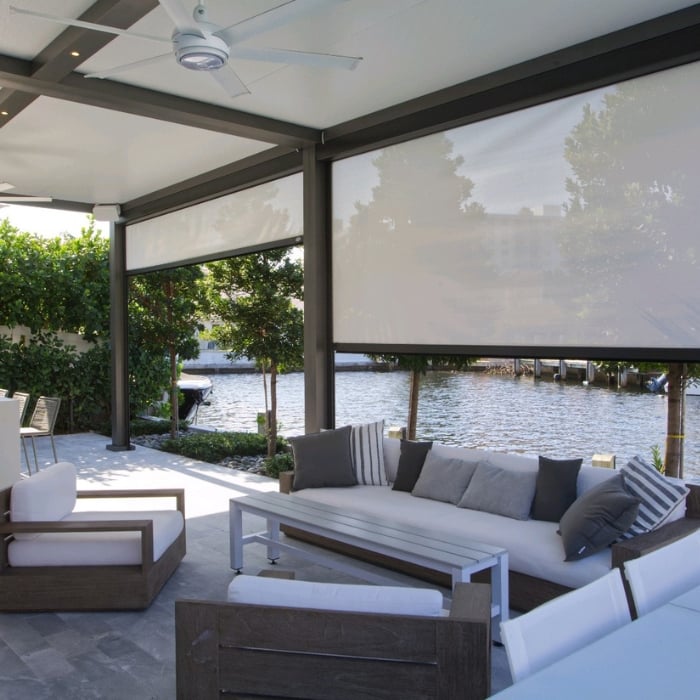 Privacy Screen Covering Small Patio Featuring Grey Furniture